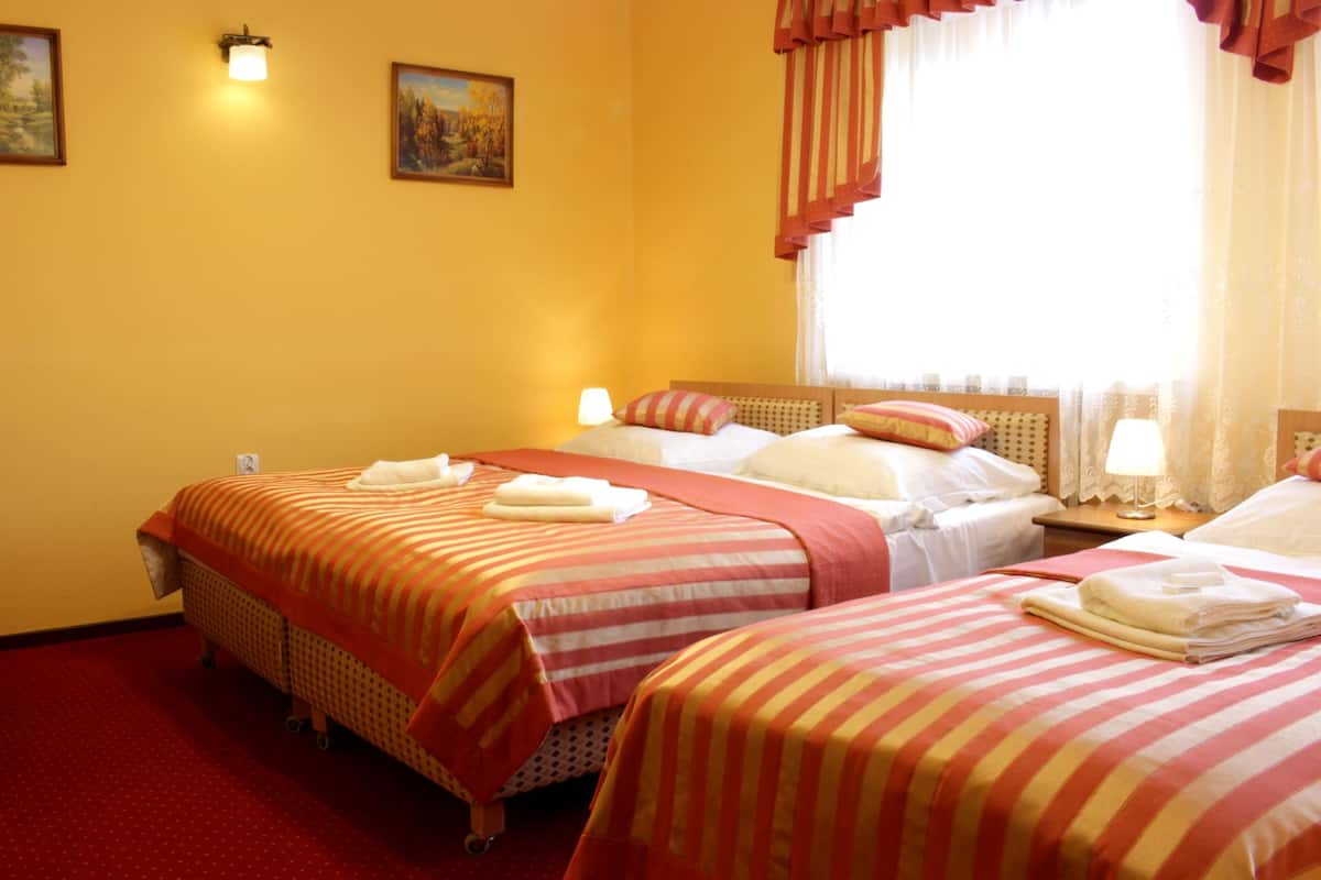 Standard Quadruple Room, 1 Bedroom, Non Smoking | Premium bedding, in-room safe, iron/ironing board, cots/infant beds