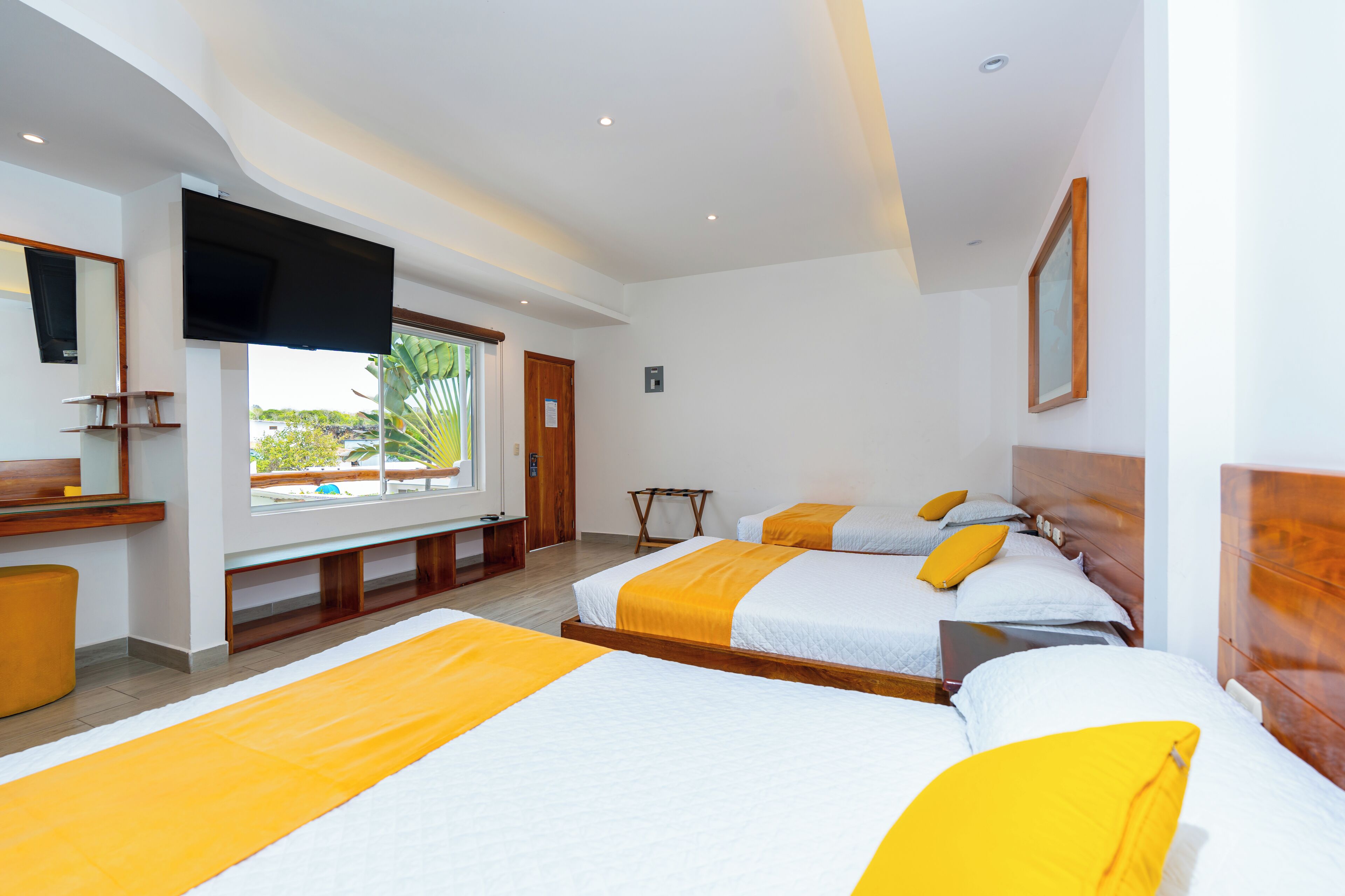 Family Room | Premium bedding, minibar, individually furnished, bed sheets