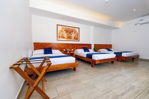 Family Room | Premium bedding, minibar, individually furnished, bed sheets - Hotel Ninfa (Puerto Ayora)