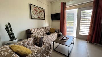 Deluxe Apartment, Multiple Beds, Non Smoking, Kitchenette | Living area | LED TV, Netflix