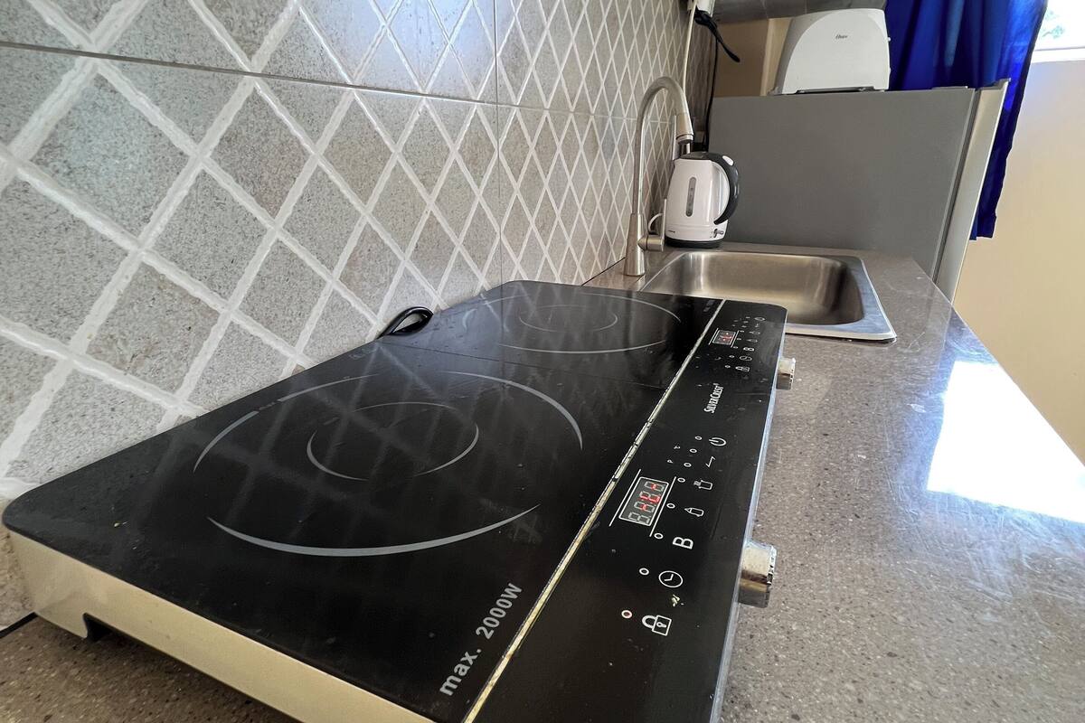 deluxe apartment, non smoking, balcony | private kitchen | fridge, stovetop, cookware/dishes/utensils