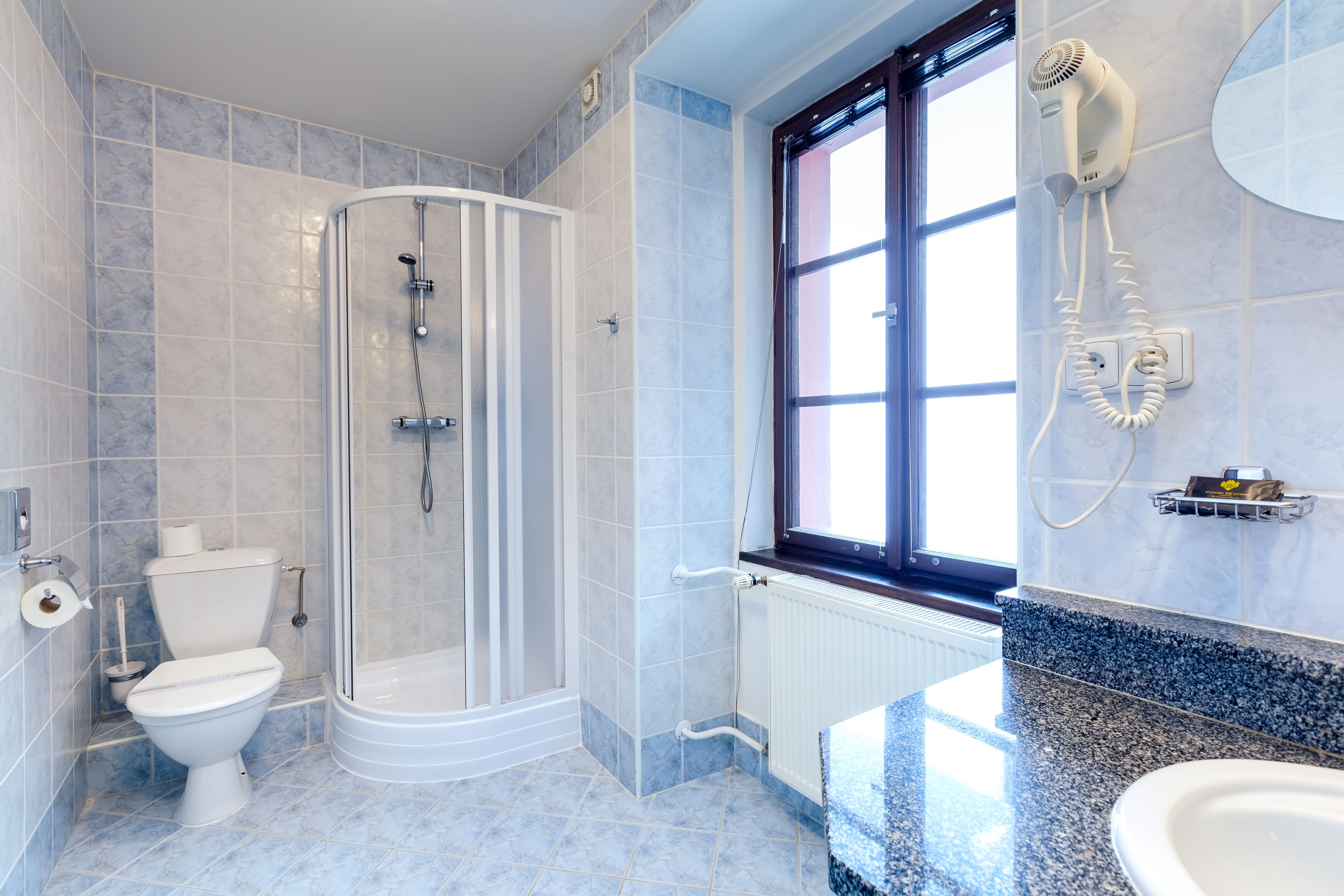 designer toiletries, hair dryer, towels