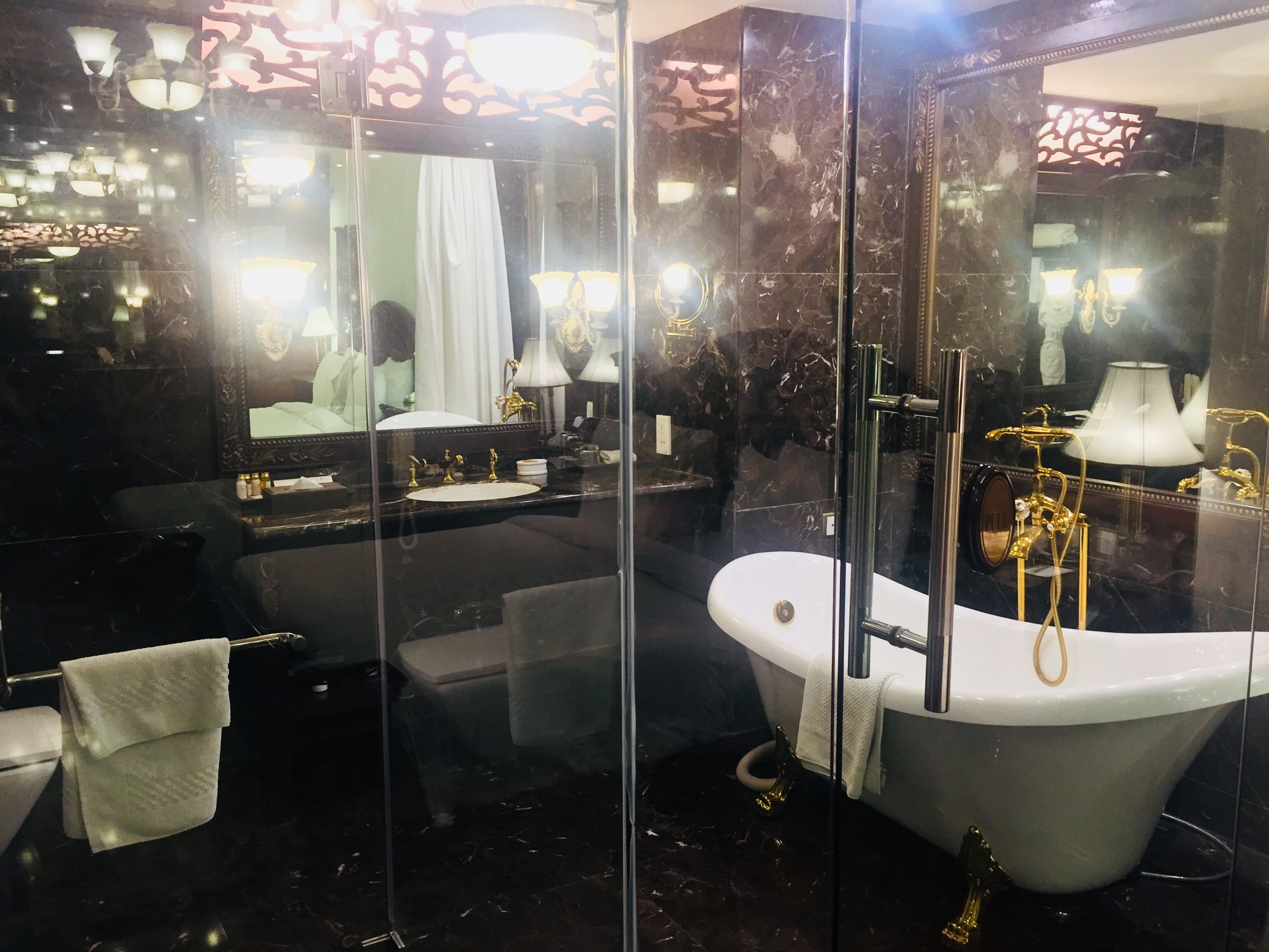 shower, eco-friendly toiletries, slippers, towels