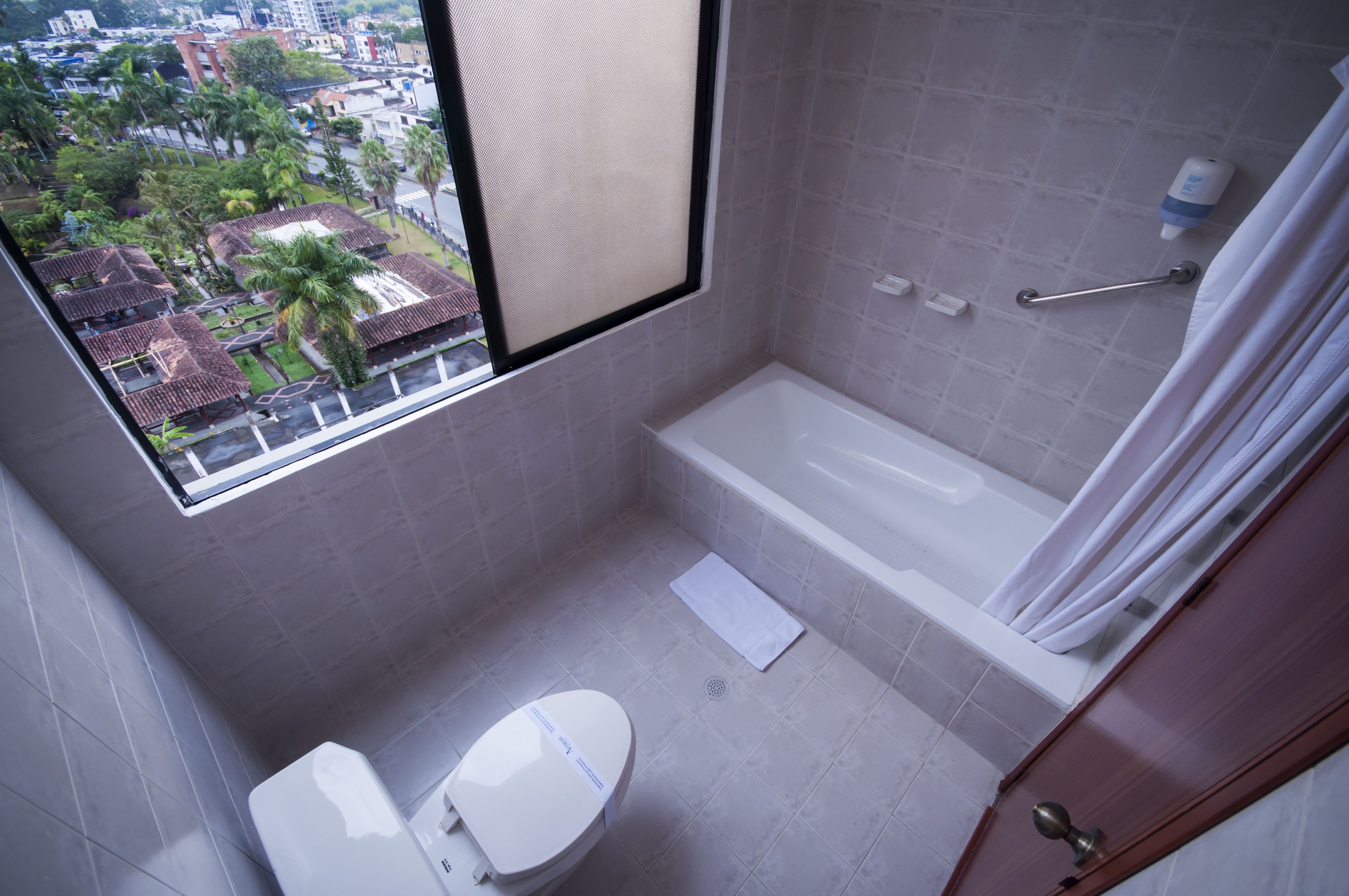 junior room, 1 king bed | bathroom | free toiletries, hair dryer, towels