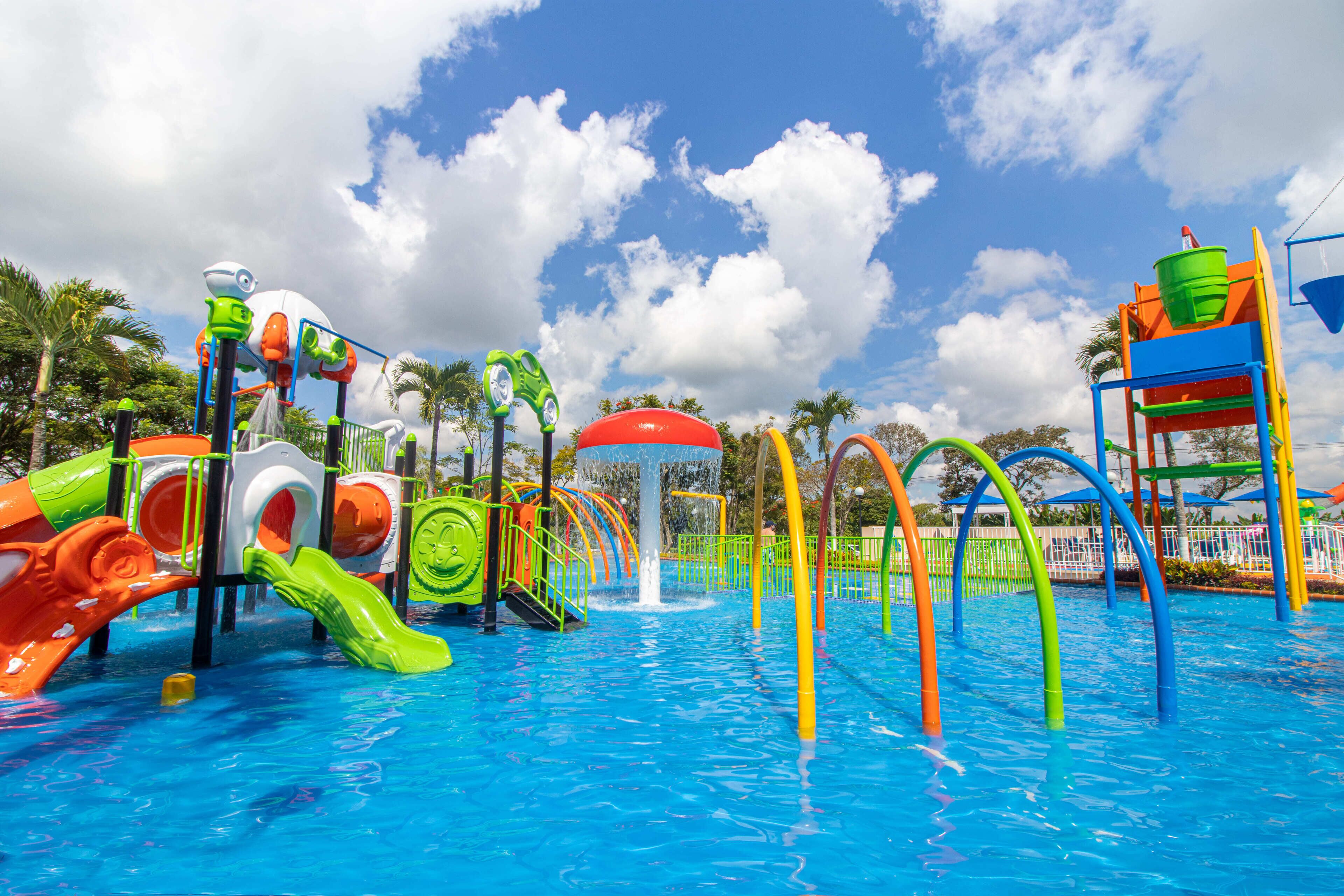 A water park with various colorful slides and play structures.
