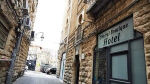 A narrow cobblestone street with a building labeled "Central Boutique Hotel" on the right. - Central Boutique Hotel (Jerusalem)