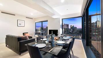 Two Bedroom Apartment | Living area | 42-inch flat-screen TV with satellite channels, TV
