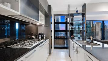 Three Bedroom Apartment | Private kitchen | Full-sized fridge, microwave, oven, stovetop