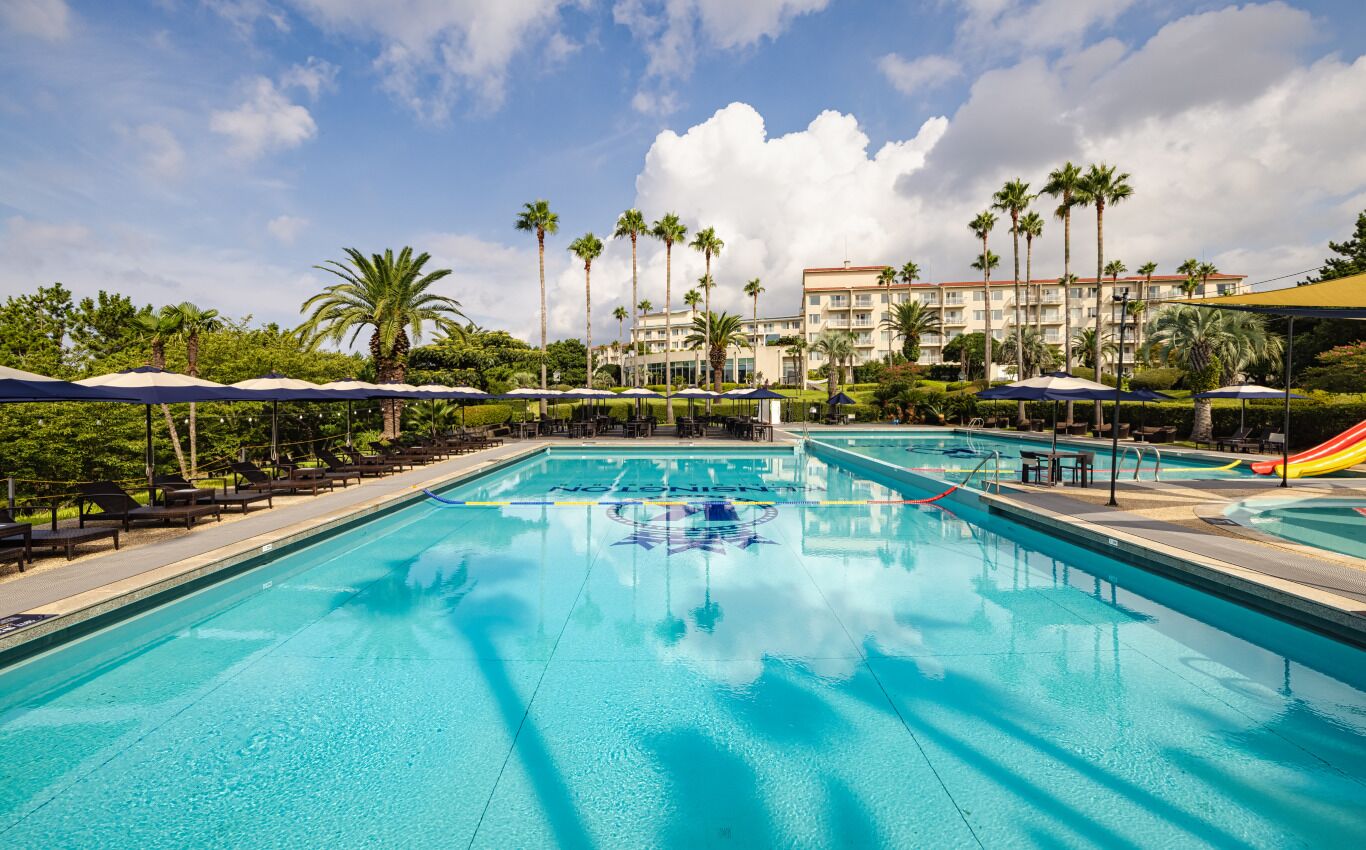 Seasonal outdoor pool, open 9:00 AM to 6:00 PM, pool umbrellas