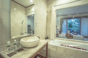 Separate bathtub and shower, hair dryer, towels