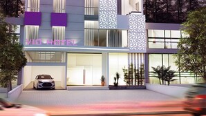 A modern hotel with a purple and white color scheme, featuring a prominent logo and the name 'VIO WESTMORE'. - VIO Westhoff (Bandung)