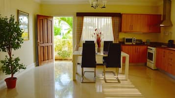 Executive Bungalow, 2 Bedrooms | Private kitchen | Full-sized fridge, stovetop, cookware/dishes/utensils