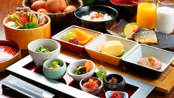 A traditional Japanese meal setup with various dishes and utensils.