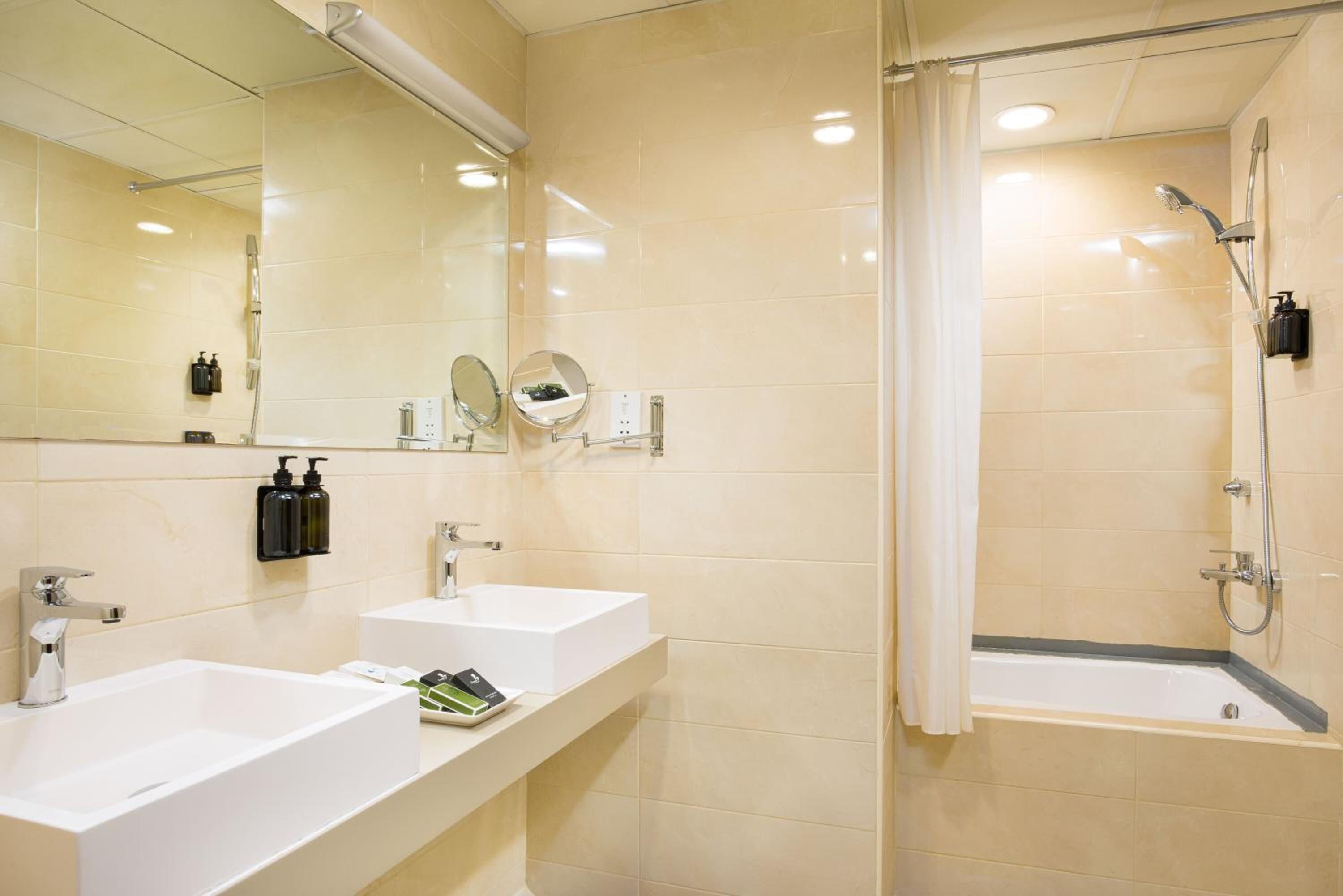 shower, hair dryer, slippers, towels