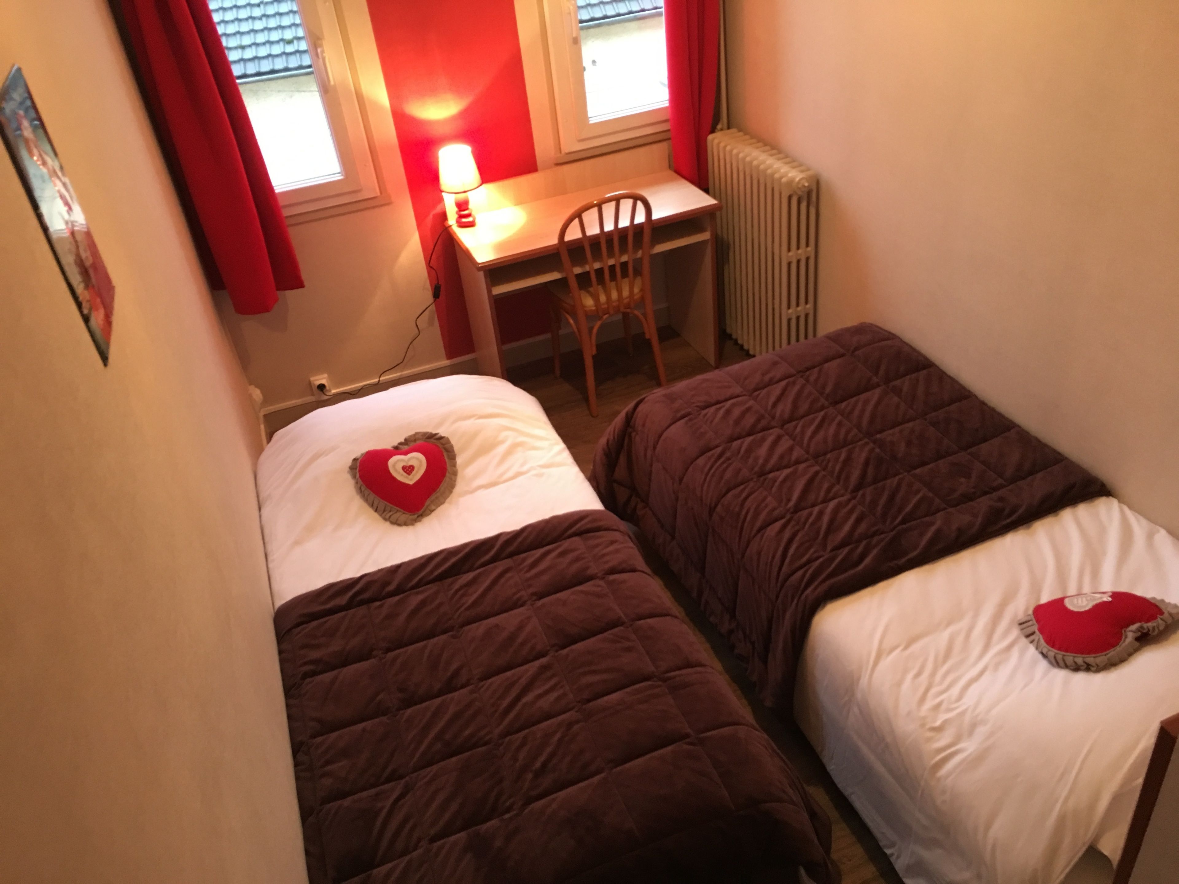 family room | desk, laptop workspace, iron/ironing board, cots/infant beds