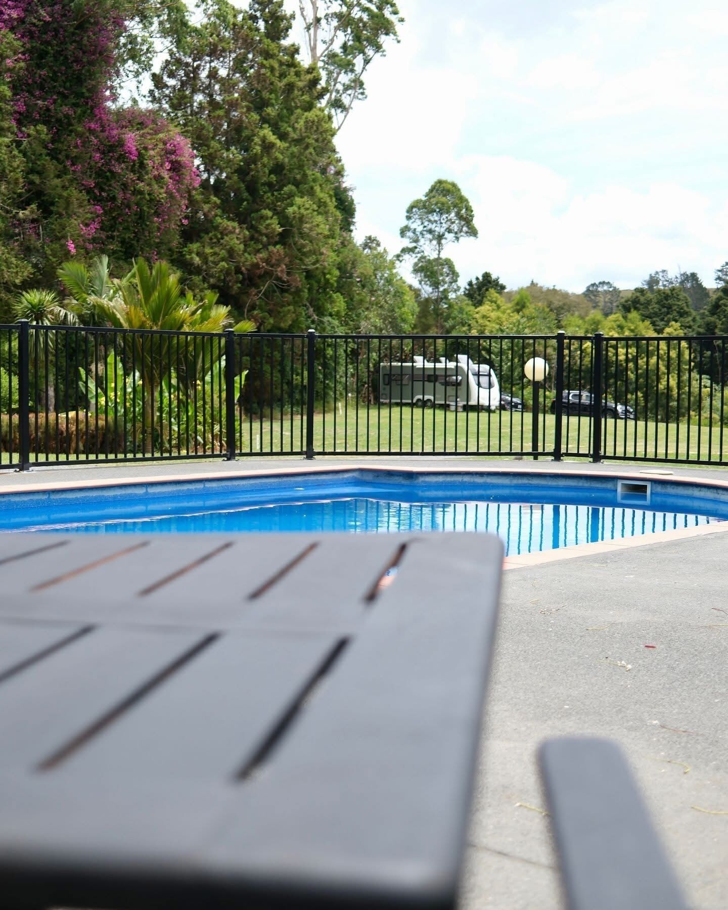 Seasonal outdoor pool, open 10:00 AM to 8:00 PM, pool umbrellas