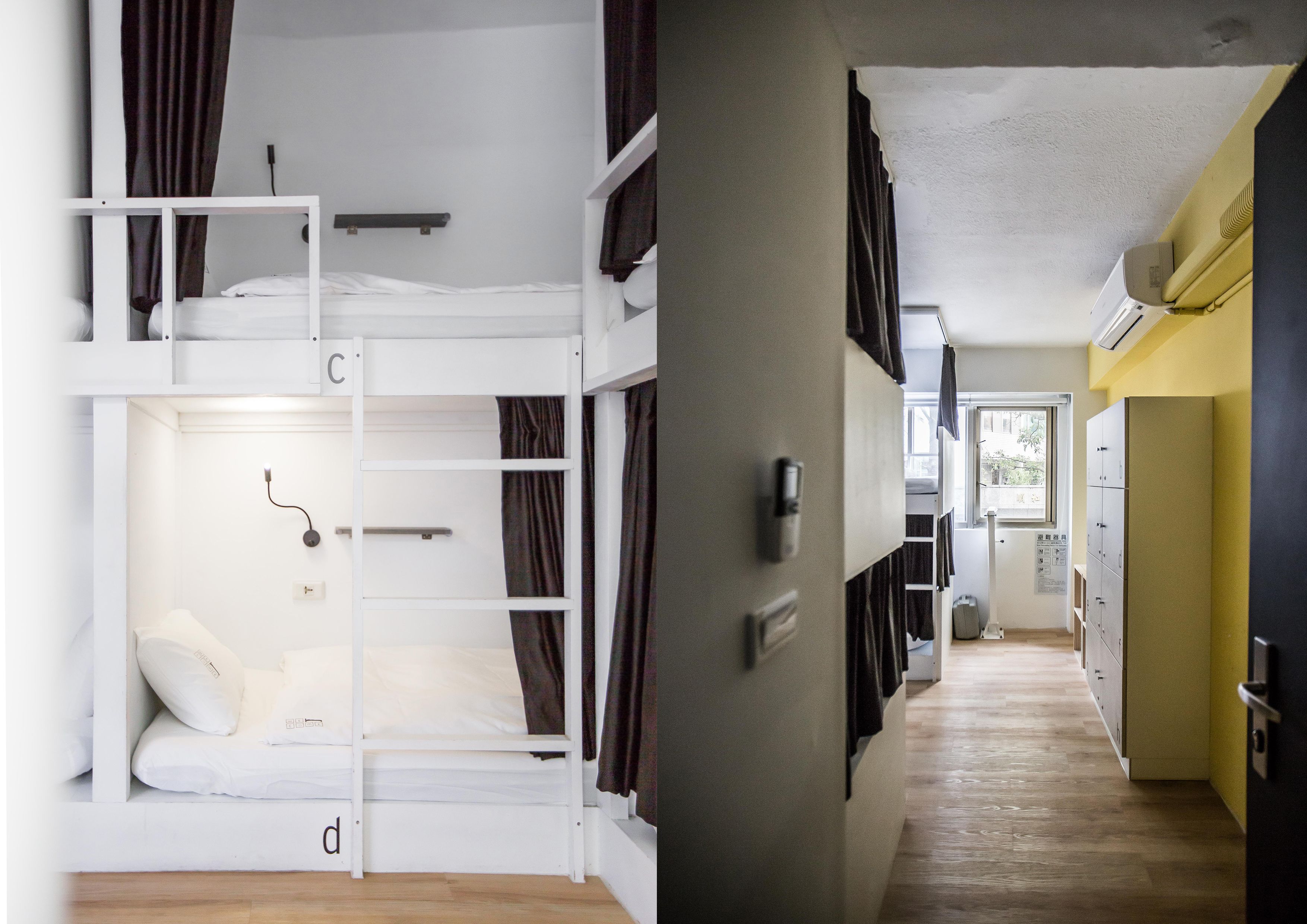 A bunk bed with a ladder, a small bedside table, and a wall-mounted light fixture.