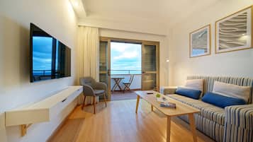 Apartment, 1 Bedroom, Sea View | Living area | Flat-screen TV