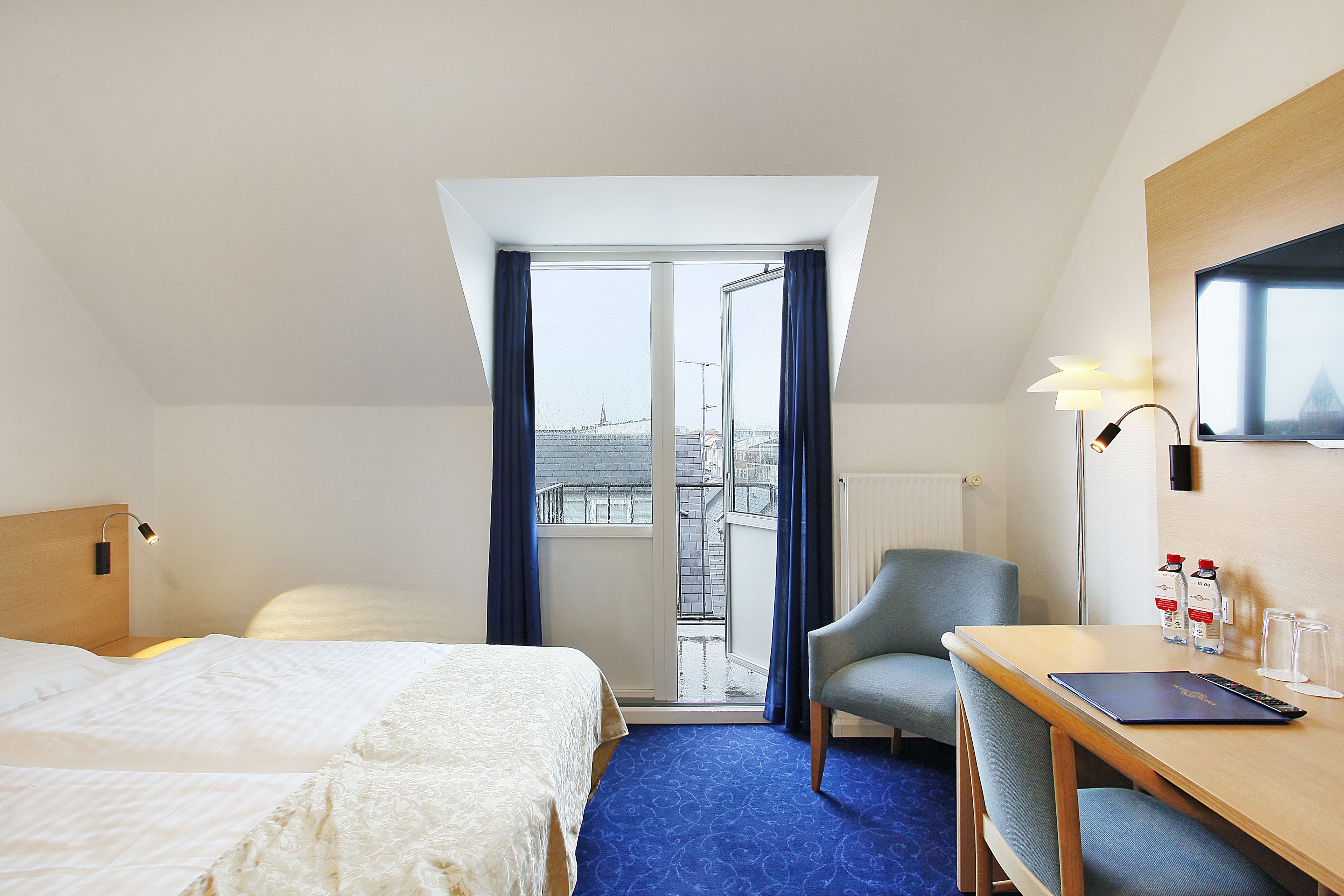 double room, balcony, city view | down duvets, in-room safe, desk, free wifi