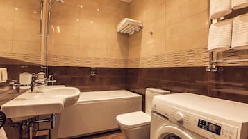 Designer toiletries, hair dryer, towels