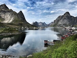 Overlooking a serene fjord, this property offers breathtaking views of the surrounding mountains and tranquil waters.