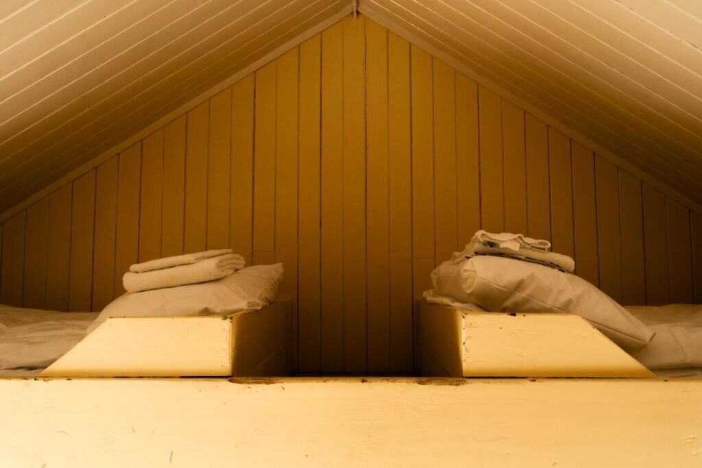 heritage cottage (private bathroom in separate building, loft beds w/stairs) | 1 bedroom, individually decorated, individually furnished, bed sheets