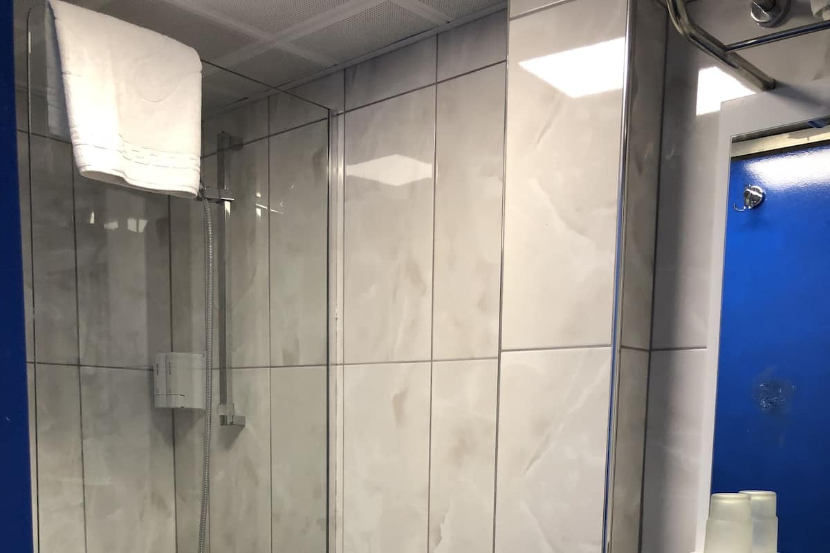 Shower, free toiletries, hair dryer, slippers