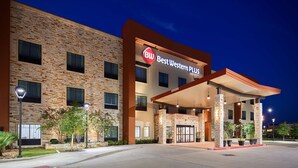 A Best Western Plus hotel with a stone facade, multiple windows, and a covered entrance area.