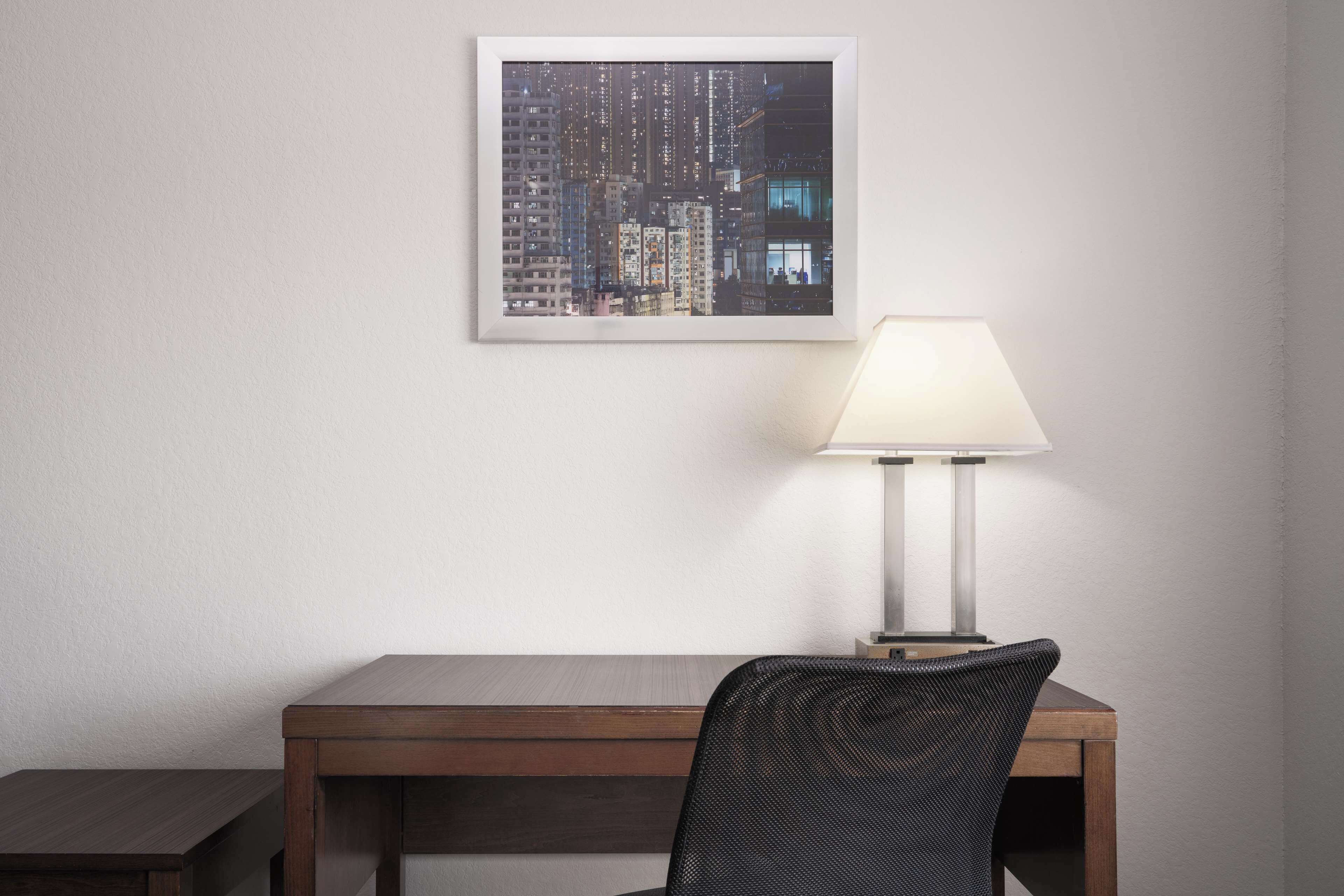 pillow-top beds, desk, laptop workspace, blackout curtains