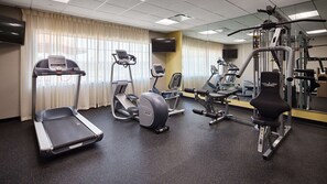A gym with treadmills, an elliptical, and weight machines. - Best Western Plus College Station Inn & Suites (College Station)