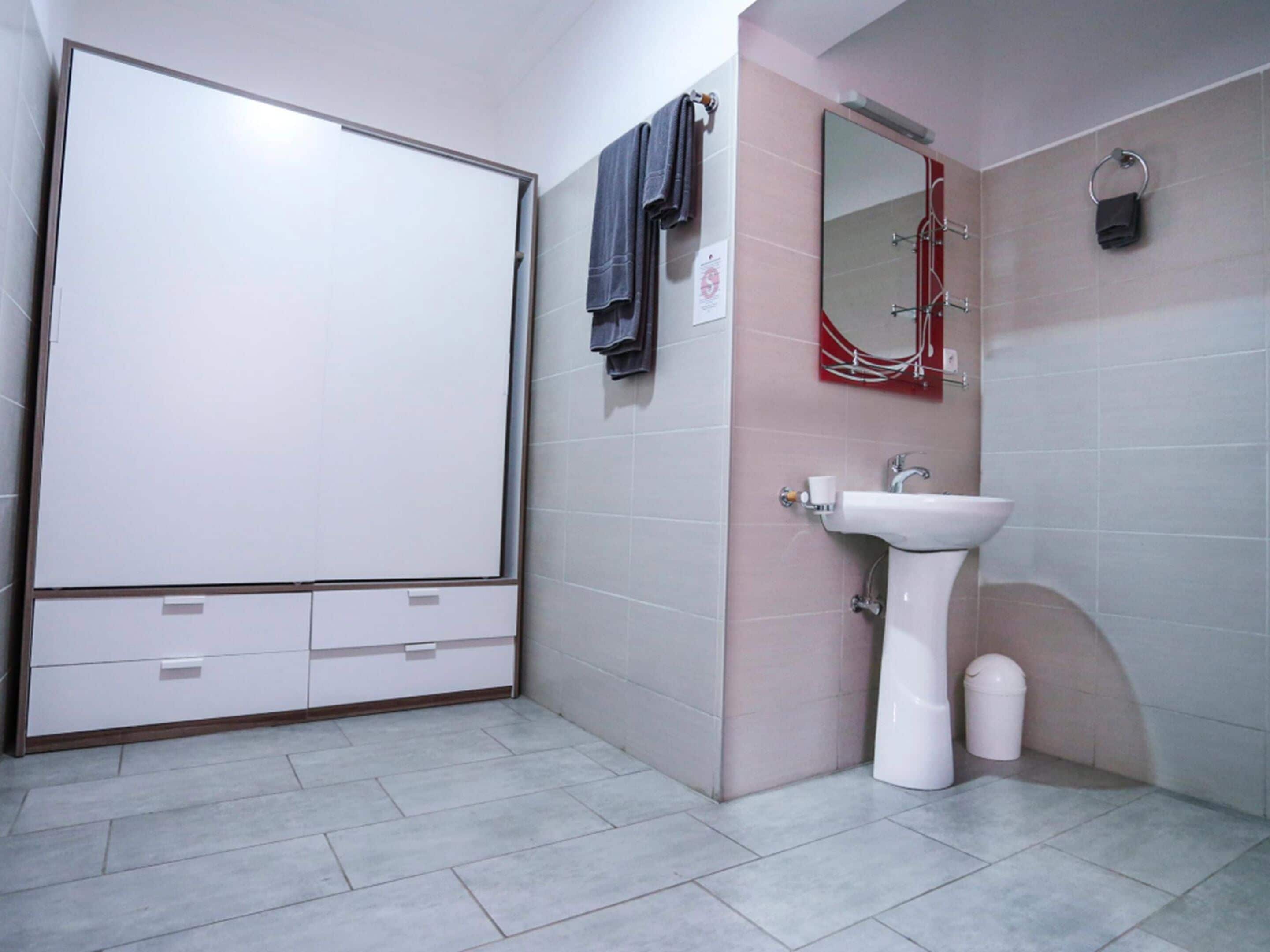 shower, hair dryer, slippers, towels