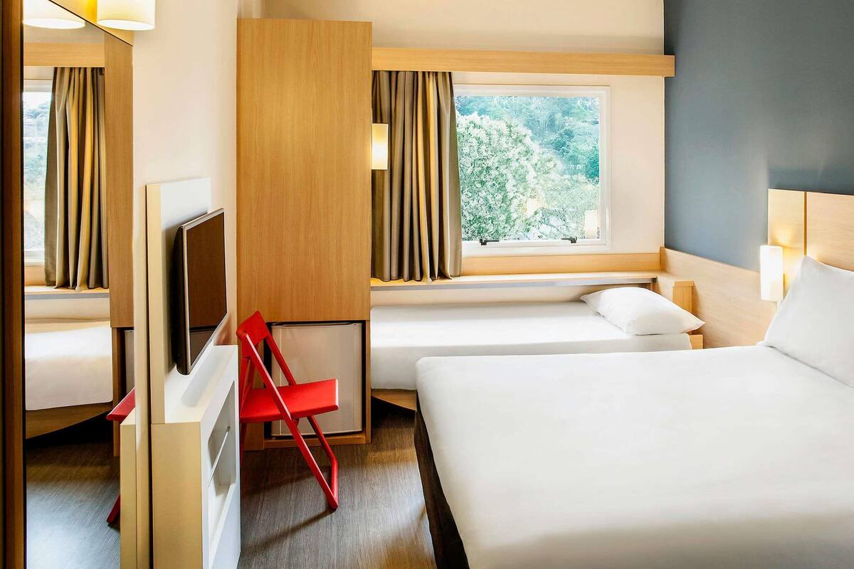 Standaard kamer, Meerdere bedden | Een minibar, gratis wifi, beddengoed