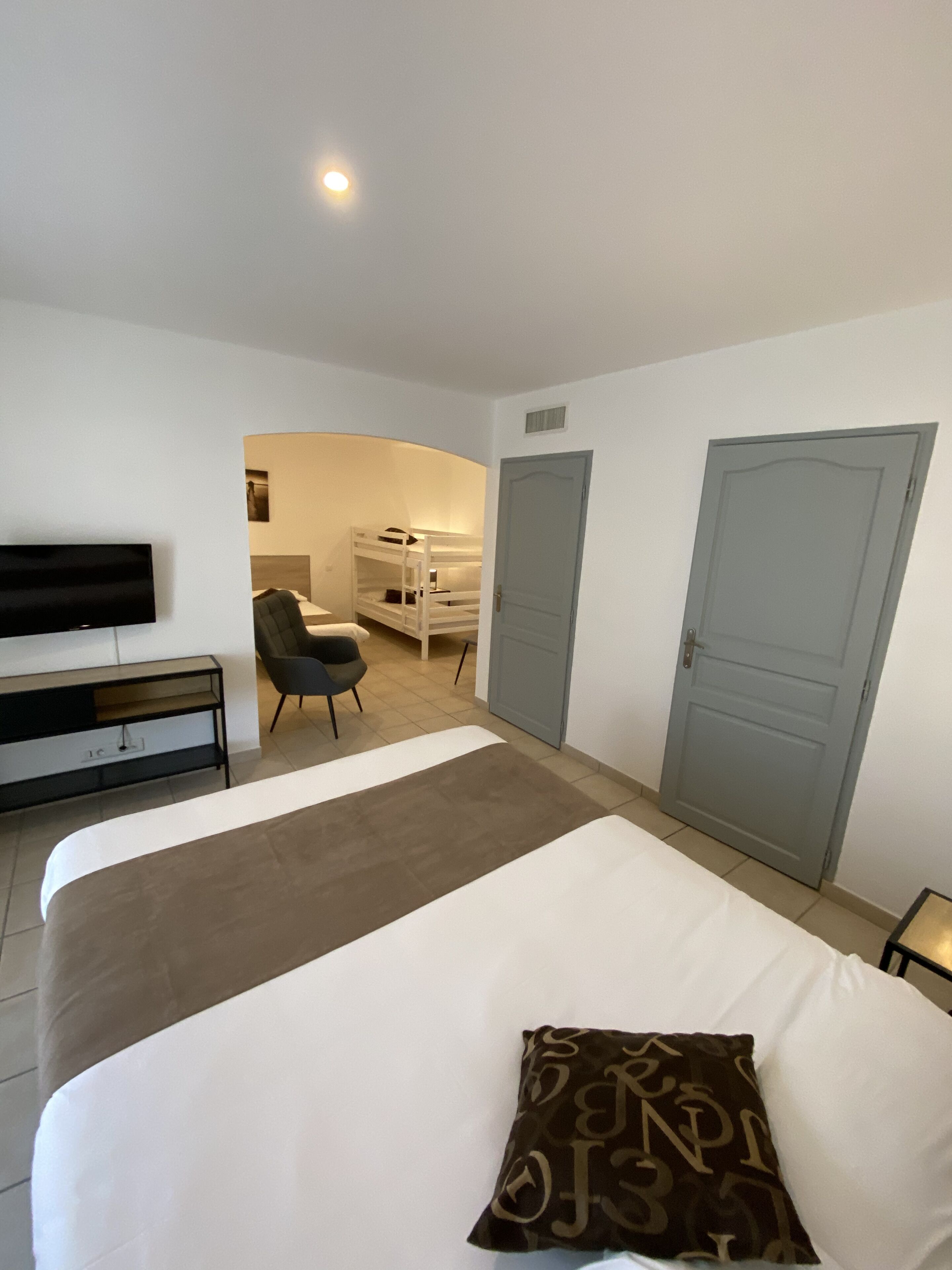 family room, multiple beds | in-room safe, desk, soundproofing, iron/ironing board