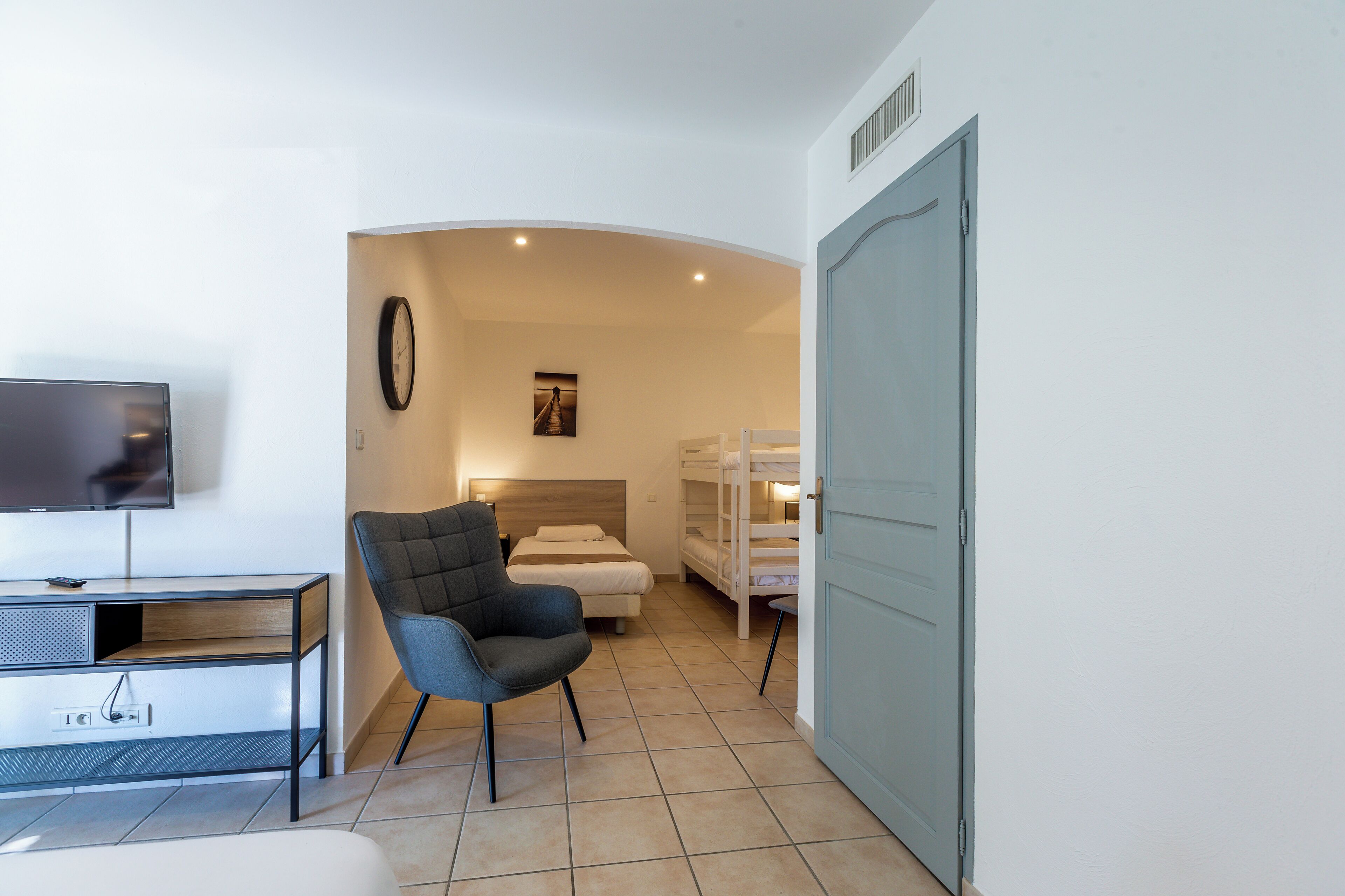 family room, multiple beds | in-room safe, desk, soundproofing, iron/ironing board