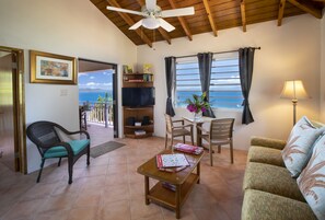 Villa, 1 Bedroom Ocean View (Paradise) | Living room | 32-inch TV with cable channels, DVD player, iPod dock - White Bay Villas and Beach Club (Jost Van Dyke)