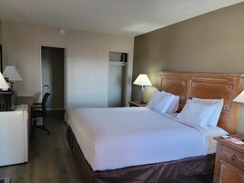 Tabla de planchar con plancha, wifi gratis y ropa de cama 