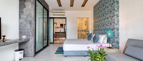 Apartment, 1 King Bed, Ground Floor | 1 bedroom, in-room safe, desk, blackout drapes