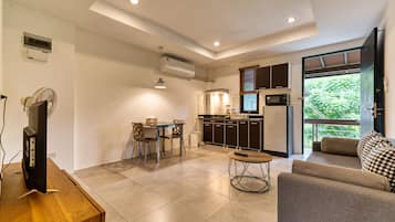 Apartment, 1 Bedroom | Living area | 40-inch flat-screen TV with digital channels, TV