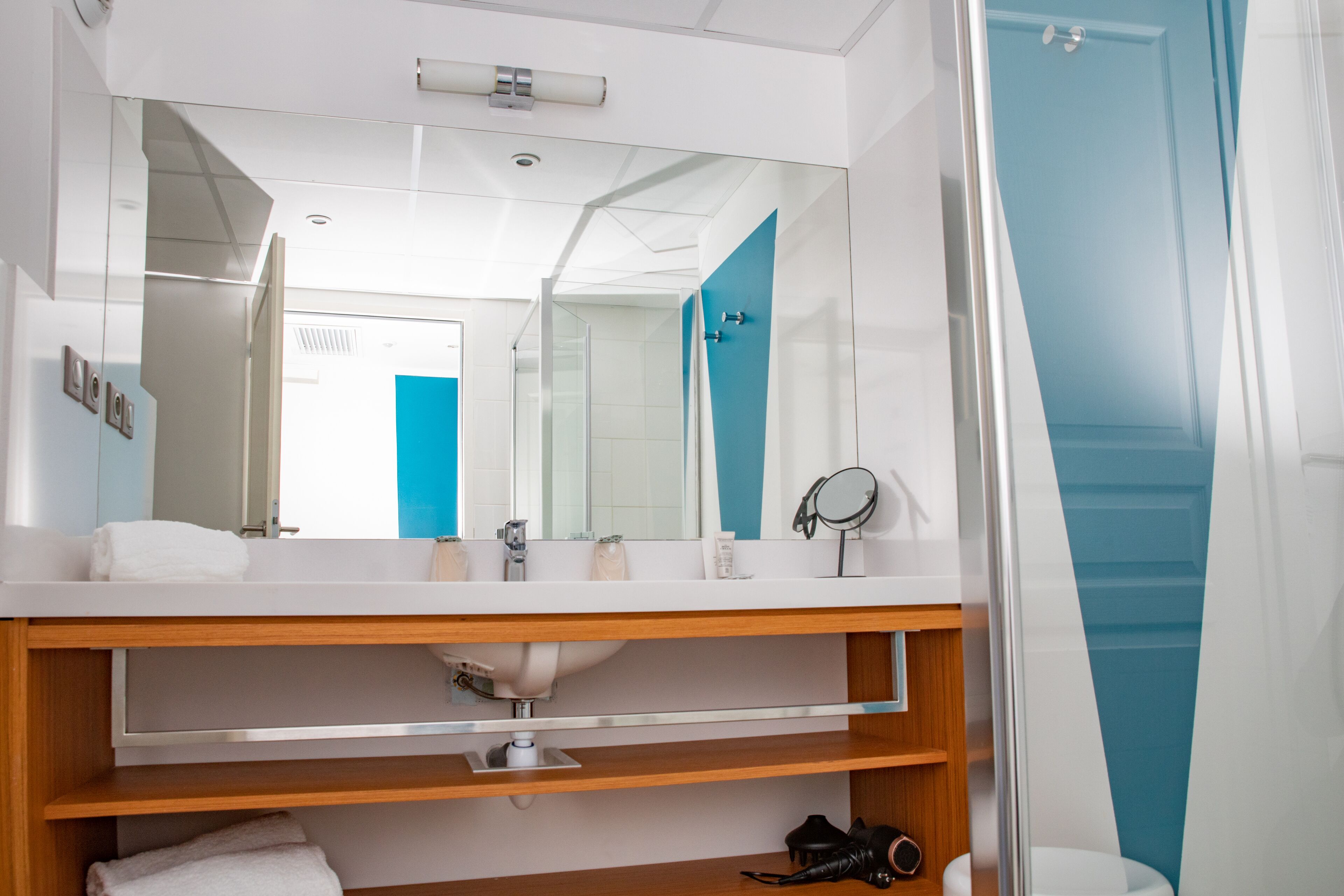 family room | bathroom | shower, hair dryer, slippers, towels