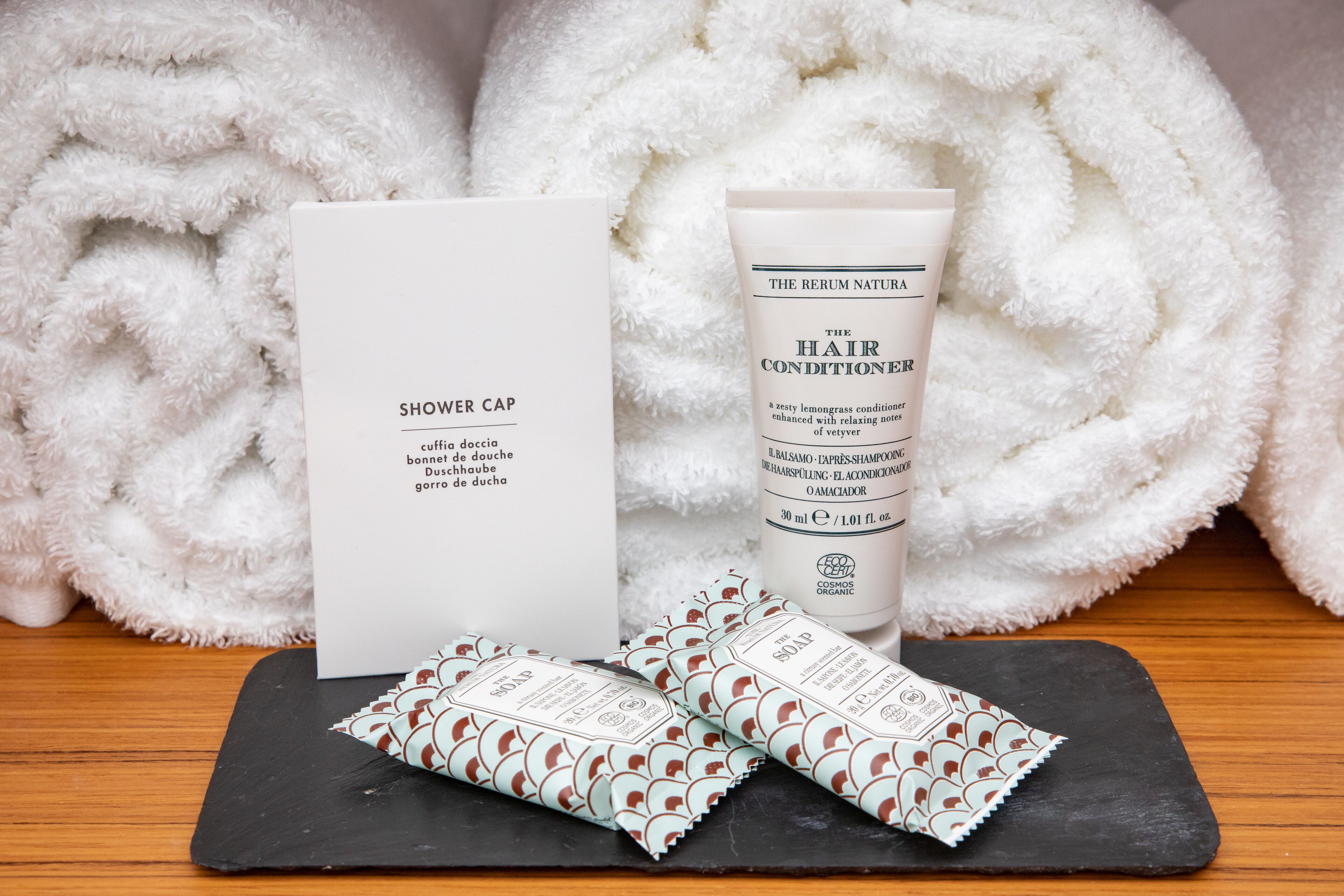 shower, hair dryer, slippers, towels