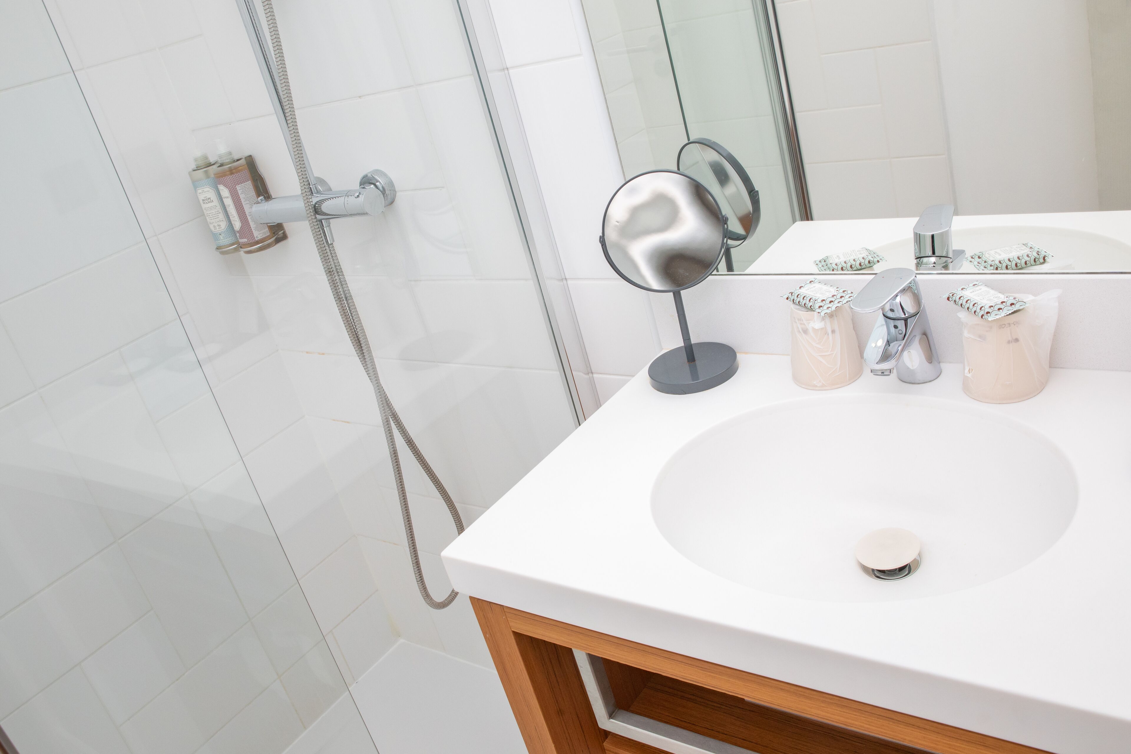 shower, hair dryer, slippers, towels