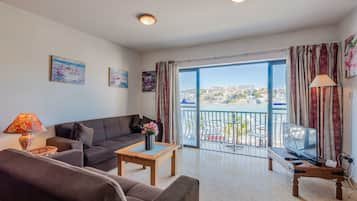 Standard Apartment, 2 Bedrooms, Sea View | Living area | Flat-screen TV