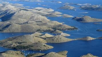 On the beach, white sand, sun loungers, beach umbrellas