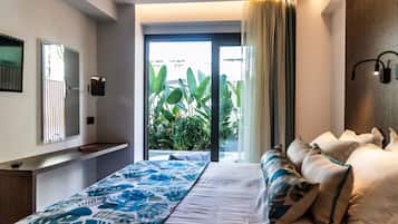 Deluxe Suite, 1 Bedroom, Pool View | Pillowtop beds, in-room safe, blackout drapes, soundproofing
