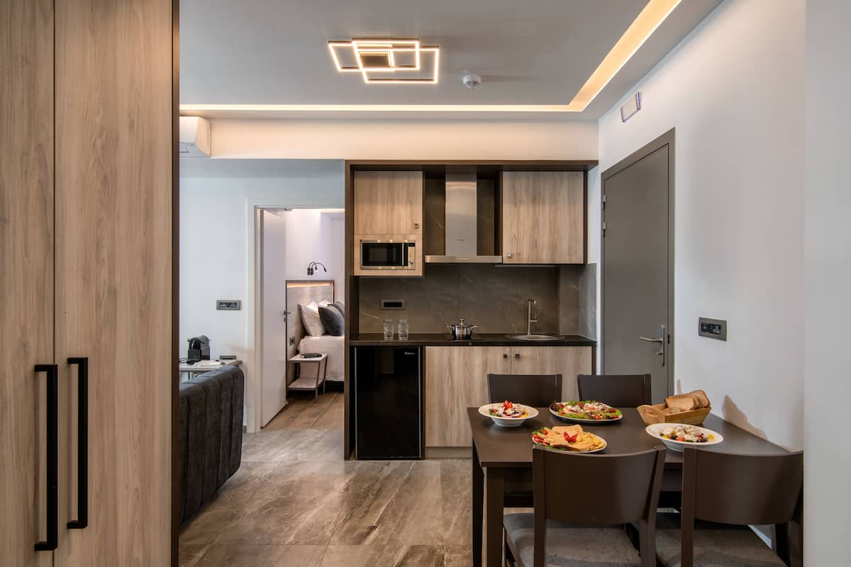 Deluxe Apartment, 1 Bedroom, Pool View | 2 bedrooms, pillowtop beds, in-room safe, blackout drapes