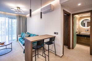 Deluxe One Bedroom Apartment with Private Pool | Living area | 42-inch Smart TV with satellite channels