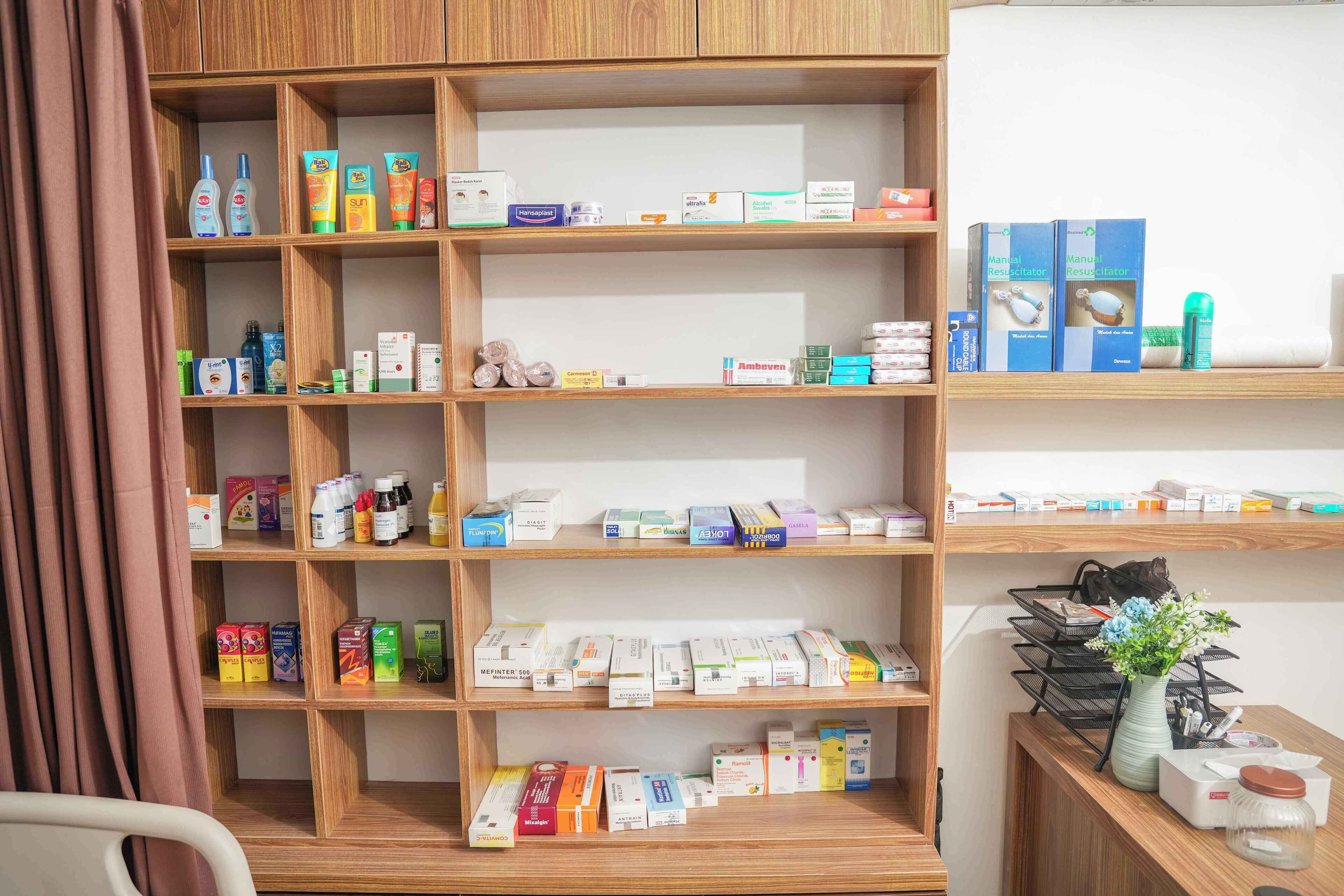A well-organized pharmacy shelf with various health and wellness products.
