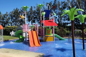 A water play area with slides and water jets.