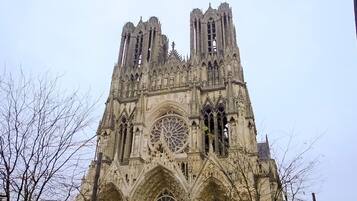 A Gothic cathedral with a large rose window and two tall spires.