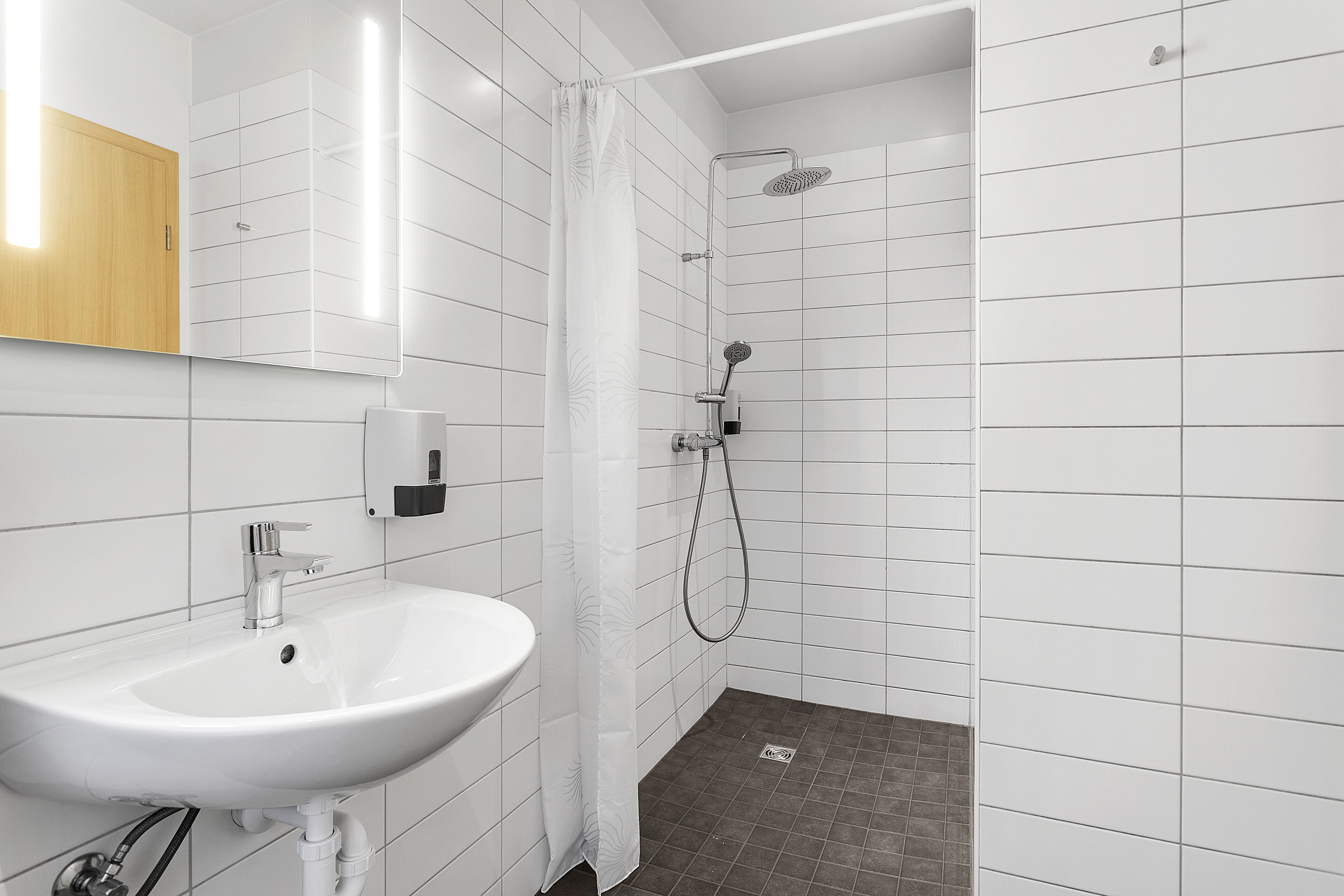 triple room (with hot tub and sauna access) | bathroom | shower, rainfall showerhead, hair dryer, towels